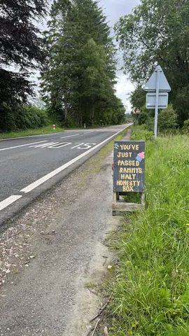 A sign on the side of a road.