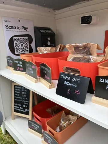 A display of food items with prices on them.