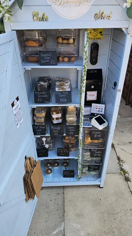 A blue box with a white sign that says "Coffee" on it.