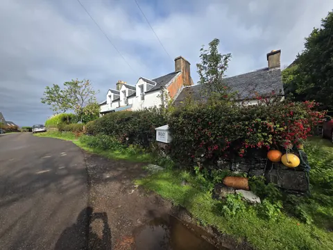 A house with a mailbox in front of it.