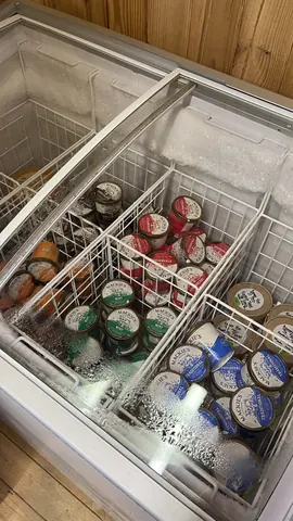 A white refrigerator with a freezer section.