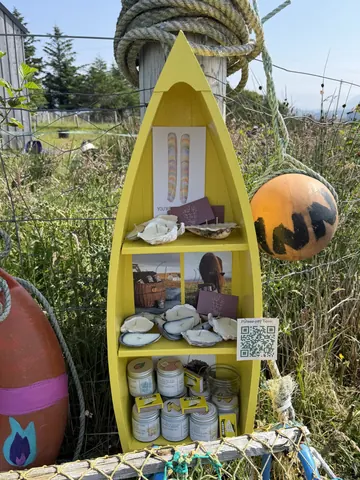 A yellow boat with a shelf inside of it.