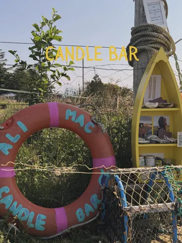 A yellow boat with a rope tied to it.