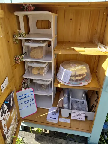 A wooden box with a cake in it.
