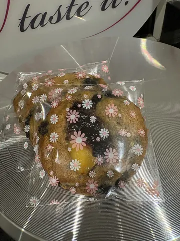 A bag of food with a flower design on it.