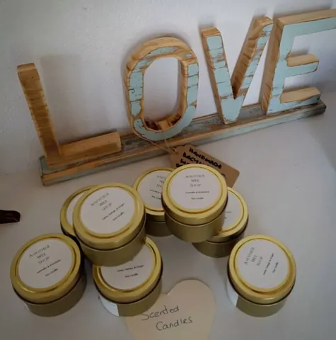 A collection of candles are displayed on a table.