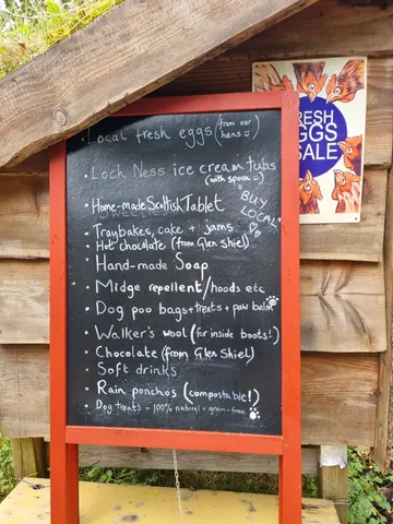 A chalkboard sign with a list of items on it.