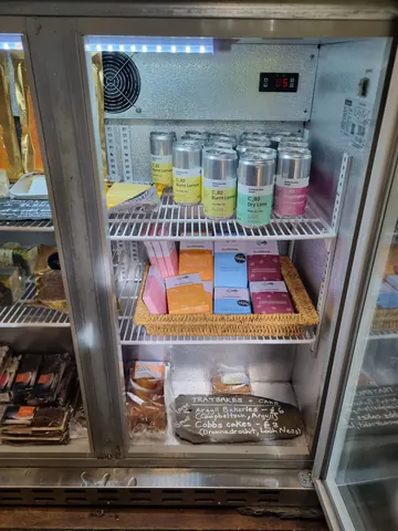 A refrigerator with a variety of food items inside.