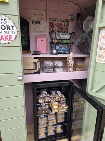 A refrigerator with a sign on the door that says "life is too short to not eat cake".