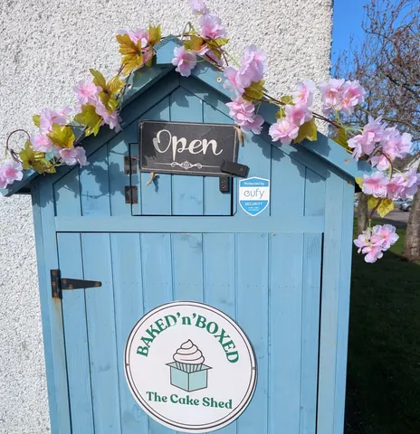 A blue door with a sign that says "open" on it.