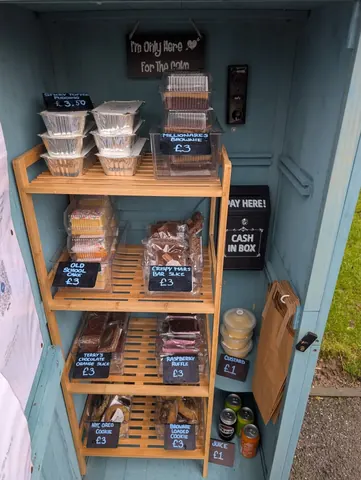 A blue box with a sign that says "Pay Here!"