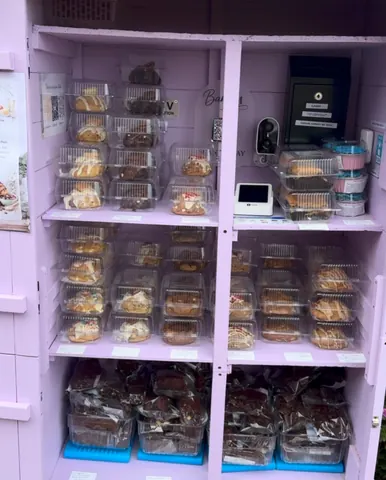 A display case filled with various desserts.