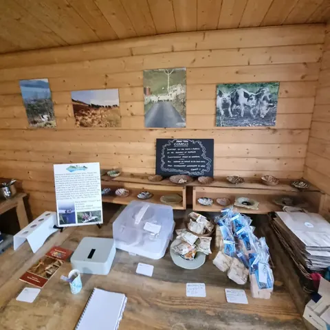 A wooden table with a white paper on it.