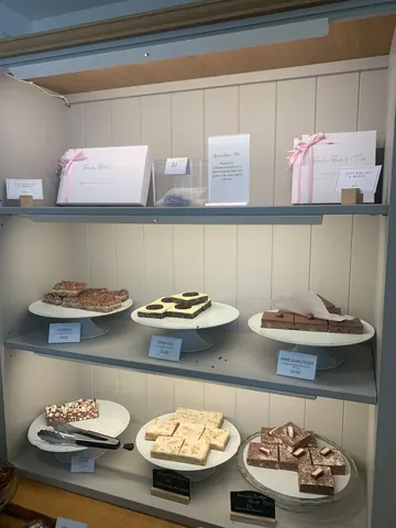 A display case with a variety of desserts.