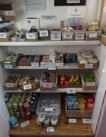 A refrigerator with a variety of food items inside.