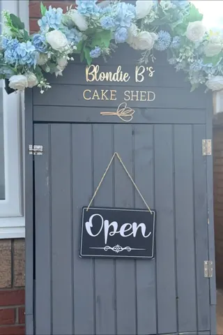 A sign that says Blondie B's Cake Shed.