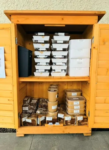 A wooden box filled with food.
