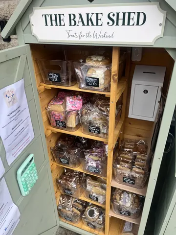 A display case with a variety of pastries and desserts.