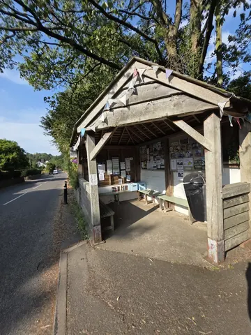 A small building with a roof and a door.
