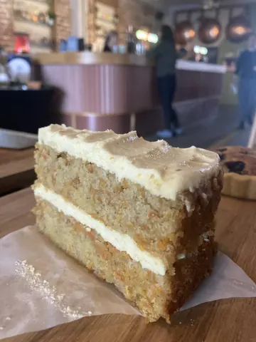 A slice of cake on a table.