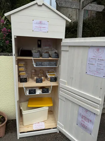 A white wooden box with a yellow lid.