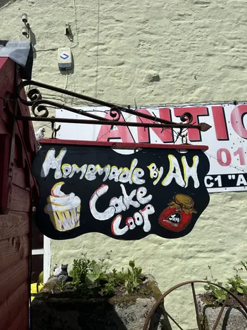 A sign for a cake shop.