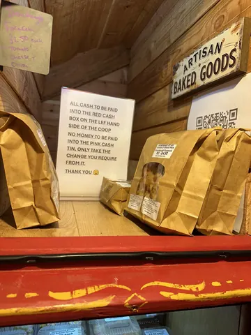 A sign that says "all bags must be held in hand" is visible.