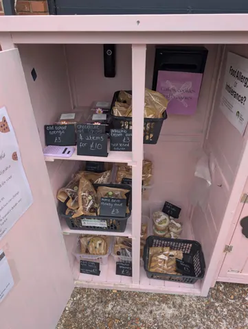 A pink cabinet with a sign that says "food allergen?".