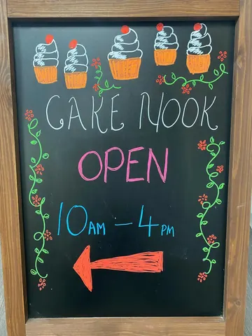 A sign that says "Cake Nook" on it.