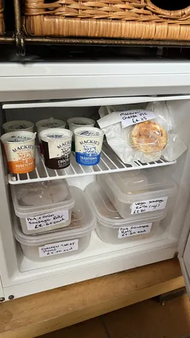 A refrigerator with a variety of food items inside.