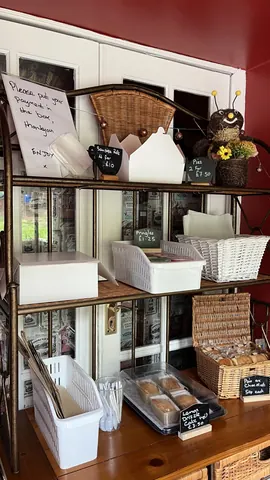 A basket of cookies is on a shelf.