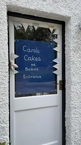 A white door with a sign on it.