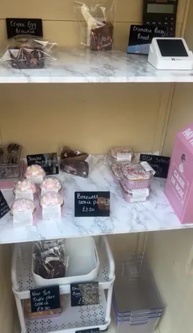 A display of pastries and desserts on a marble counter.