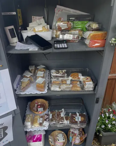 A display case with a variety of food items.