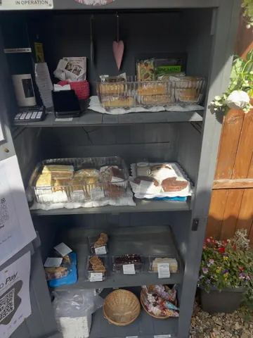 A display case filled with various food items.