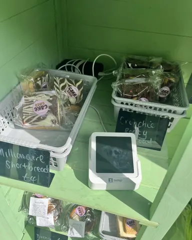 A display of food items, including cookies and cakes, is on a table.