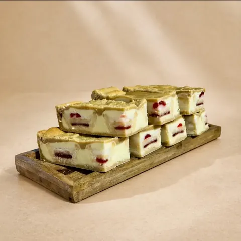 A wooden tray with a dessert on it.