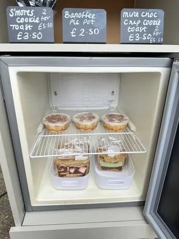 A refrigerator with a sign on the door that says "War for sale".