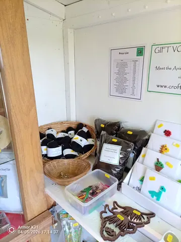 A basket of wine bottles and a sign that says gift voucher.
