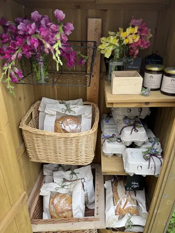 A basket of bread and flowers.