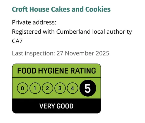A green and white sign that says "Food Hygiene Rating".