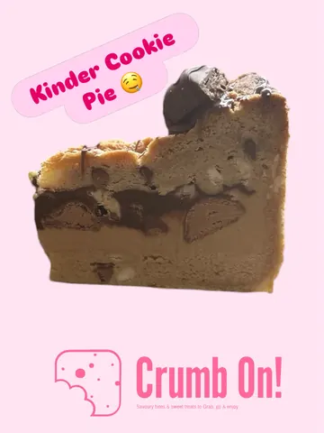 A slice of chocolate cake with chocolate chips.