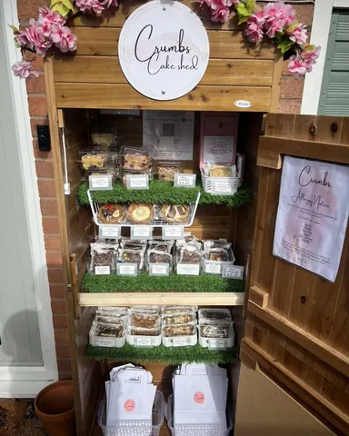 A display case filled with various desserts.