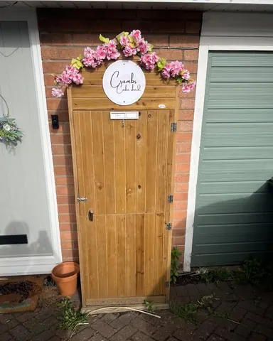 A wooden door with a sign on it.