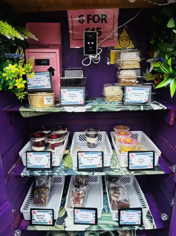 A display case with a variety of food items.