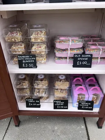 A display case with various desserts in it.