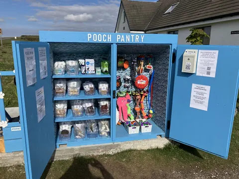 A blue box with the word "Pouch Pantry" written on it.