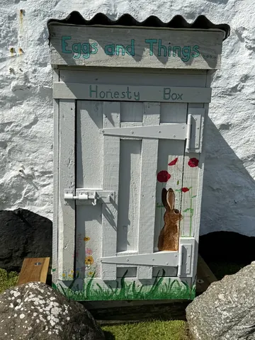 A white door with a rabbit painted on it.