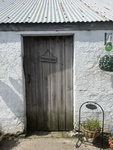 A white door with a sign on it.