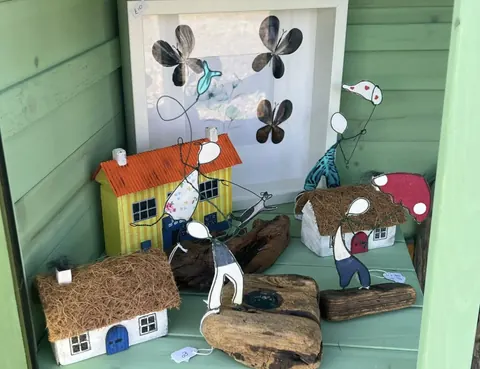A picture of a house with a man and a woman in it.